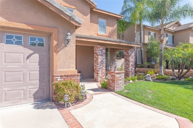 property entrance with a yard and a garage