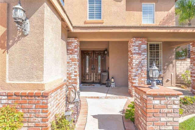 doorway to property featuring covered porch