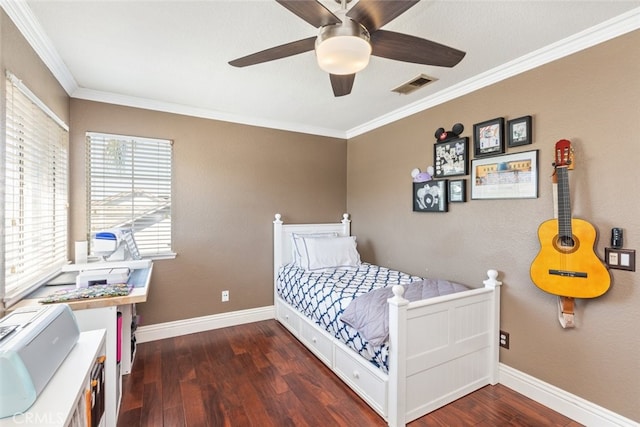 bedroom featuring ornamental molding, ceiling fan, and dark hardwood / wood-style flooring