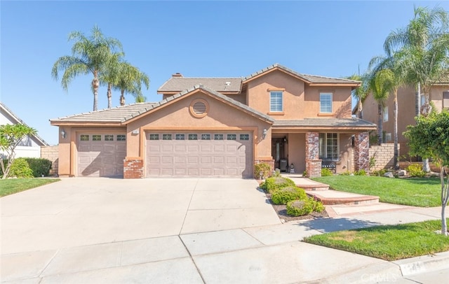 view of front of house with a front yard and a garage