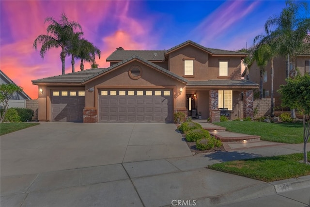 view of front of house with a lawn and a garage