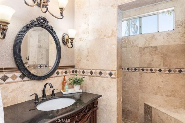 bathroom with vanity and tile walls