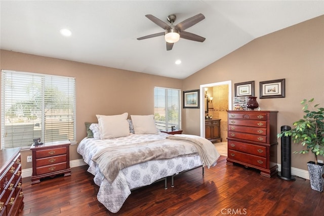 bedroom featuring dark wood-type flooring, ensuite bathroom, multiple windows, and ceiling fan