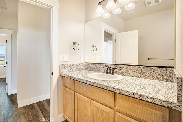 bathroom featuring wood-type flooring and vanity