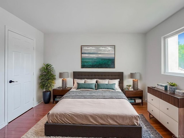 bedroom with wood-type flooring