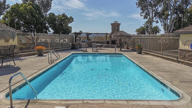 view of pool featuring a pergola and a patio area