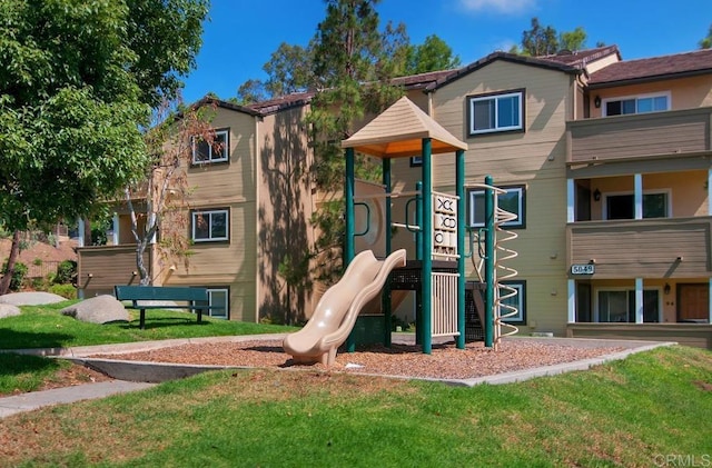 view of play area featuring a lawn