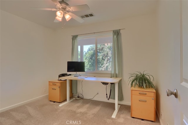 carpeted home office with ceiling fan