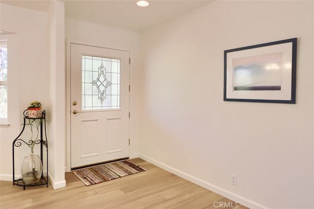 doorway to outside featuring hardwood / wood-style flooring