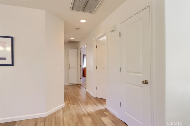 corridor with light wood-type flooring