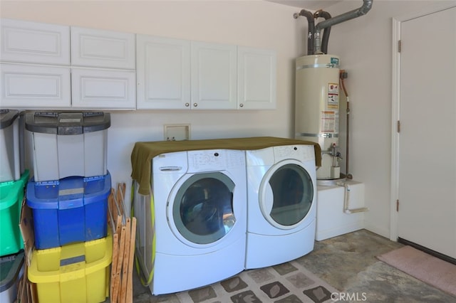 laundry area featuring cabinets, water heater, and washer and clothes dryer