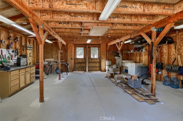 miscellaneous room with a workshop area and washer and dryer