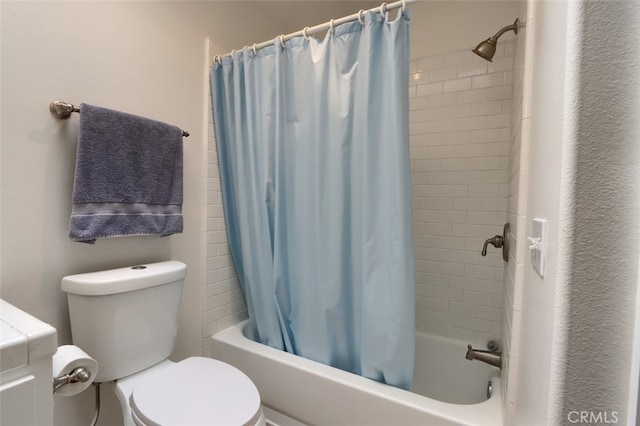 bathroom with toilet and shower / tub combo with curtain