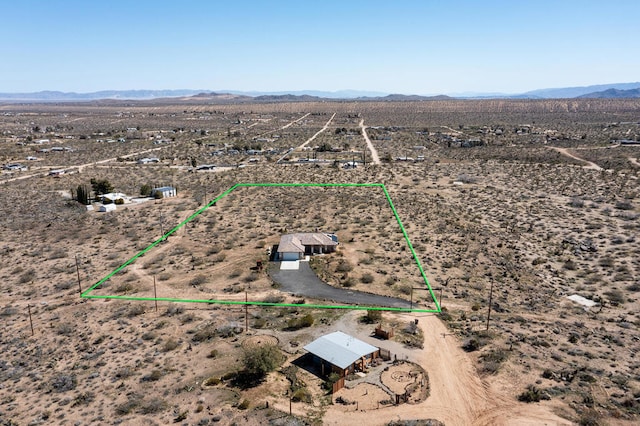 birds eye view of property featuring a mountain view