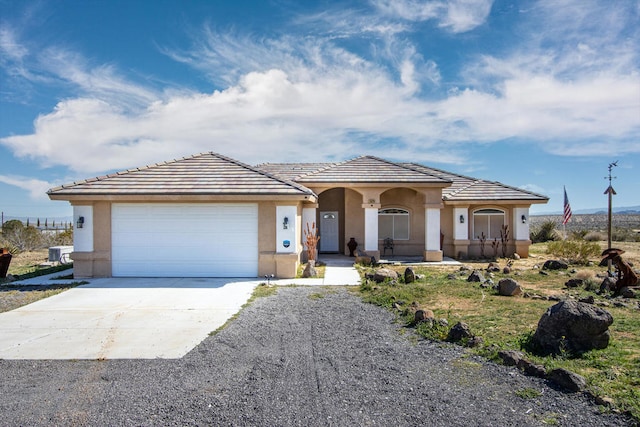 view of front of house with a garage and a porch