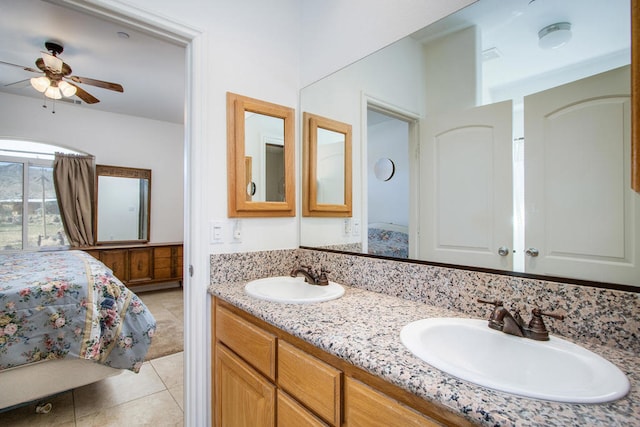 bathroom featuring ceiling fan, vanity, and tile patterned floors