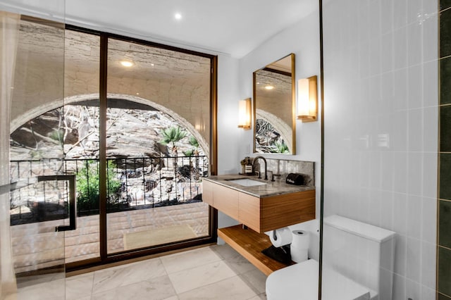 interior space featuring tile walls and sink