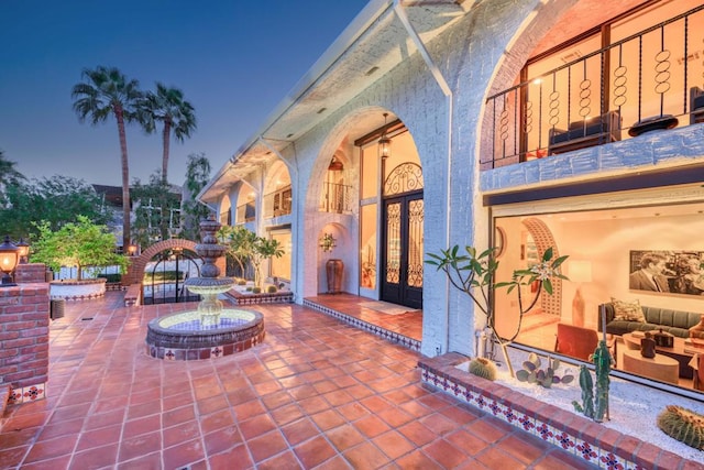 view of patio terrace at dusk