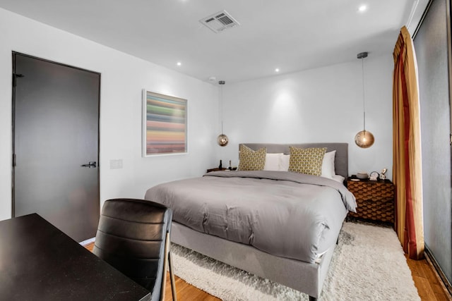 bedroom with light hardwood / wood-style floors