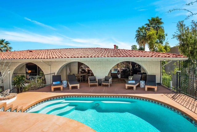 view of swimming pool featuring outdoor lounge area and a patio