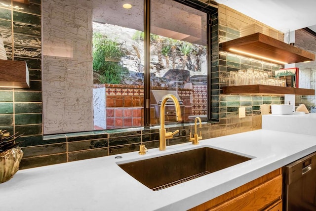 kitchen featuring stainless steel dishwasher and sink