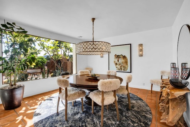 dining space featuring light tile patterned flooring