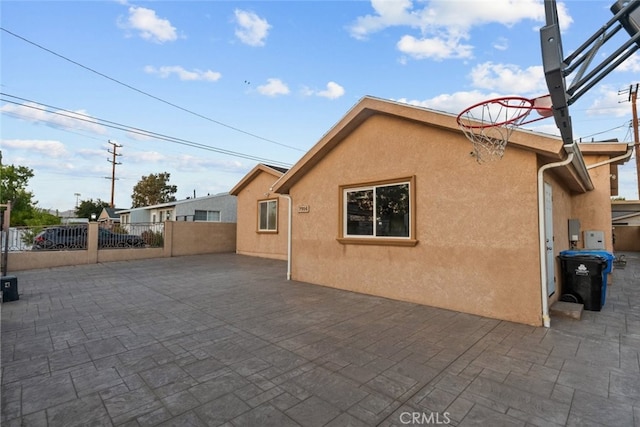 view of side of property with a patio area