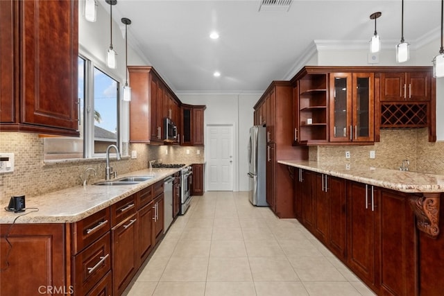 kitchen with backsplash, sink, pendant lighting, and stainless steel appliances