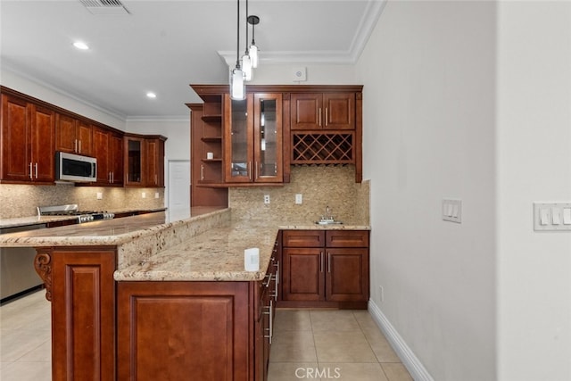 kitchen with light tile patterned floors, pendant lighting, stainless steel appliances, and tasteful backsplash