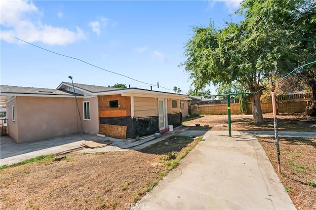 view of side of property with a patio