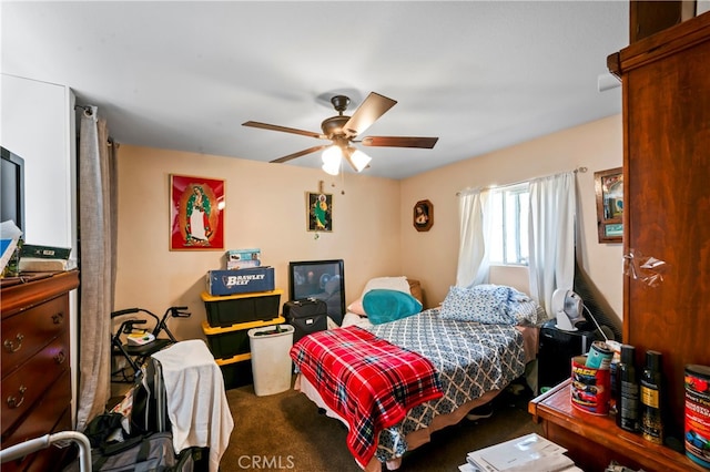 bedroom featuring dark colored carpet and ceiling fan