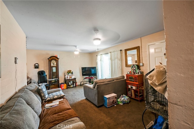 living room featuring carpet and ceiling fan