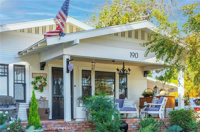 property entrance featuring covered porch