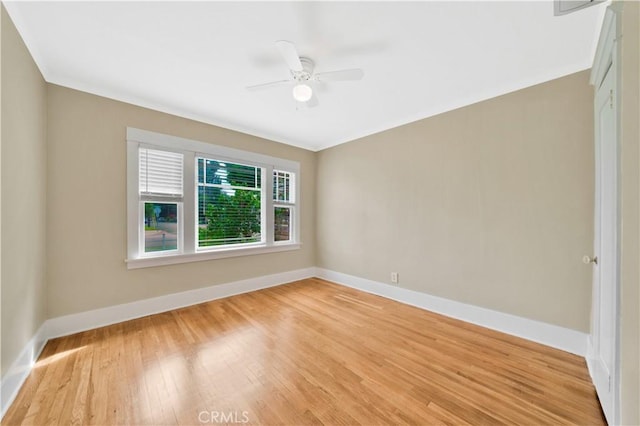 empty room with ceiling fan and wood-type flooring