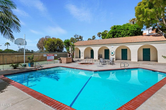 view of swimming pool with a patio