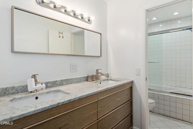 full bathroom with enclosed tub / shower combo, tile patterned flooring, vanity, and toilet