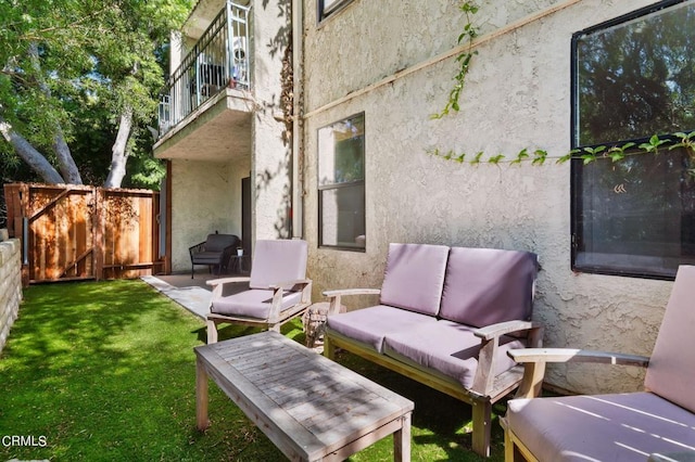 view of patio featuring a balcony