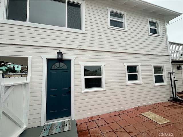 entrance to property with a patio area