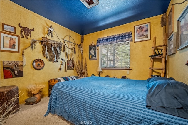 carpeted bedroom with a textured ceiling