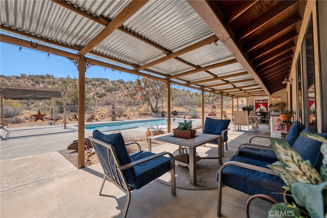 view of patio with a mountain view and a fenced in pool