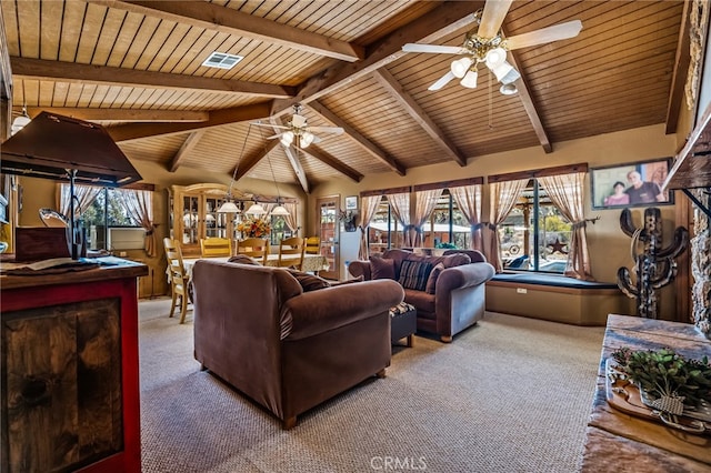 living room with carpet floors, lofted ceiling with beams, and plenty of natural light