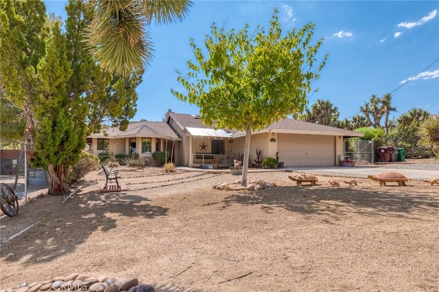 single story home featuring a garage