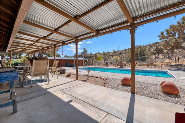 view of swimming pool with a patio area