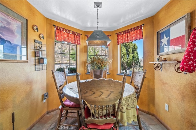 dining area featuring tile patterned flooring