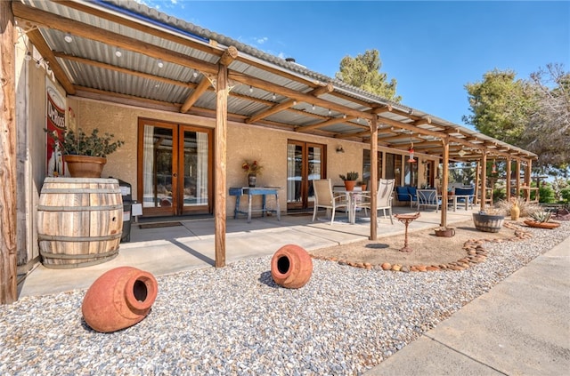 back of house featuring french doors and a patio