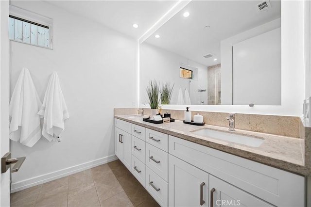 bathroom with tile patterned flooring and vanity