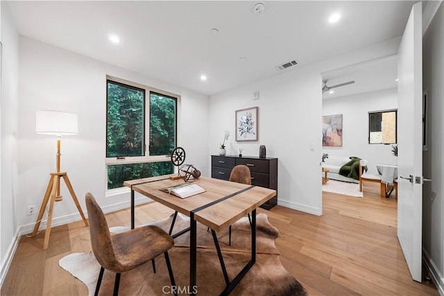 dining room featuring ceiling fan and light hardwood / wood-style flooring