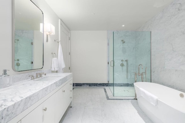 bathroom featuring vanity and separate shower and tub