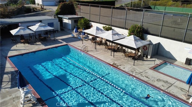 view of swimming pool featuring a patio