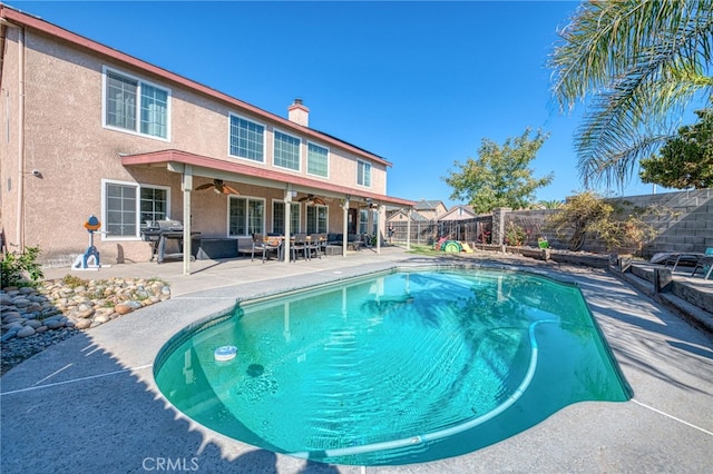 view of pool featuring a patio, ceiling fan, and a grill